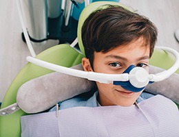 Boy wearing a nasal mask at the dentist’s office