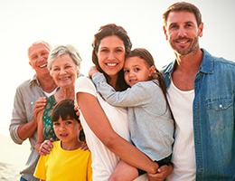 Family smiling after receiving oral healthcare with nitrous oxide